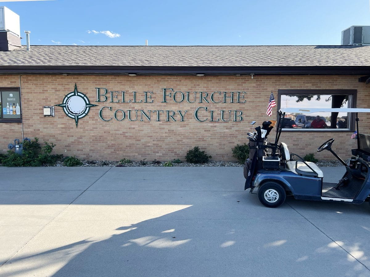 Exterior of building and sign of Belle Fourche Country Club