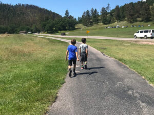 creekside trail boys on paved path 300x225