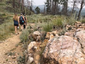 lovers lea trail women hiking with view and rocks 300x225
