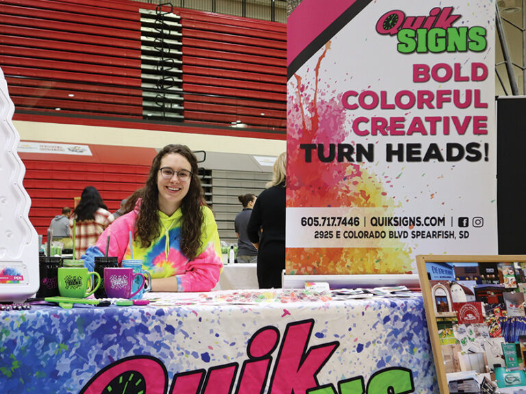 quik signs products booth 768x576