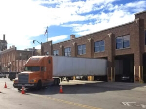 north western warehouse truck unloading at warehouse 1 300x225