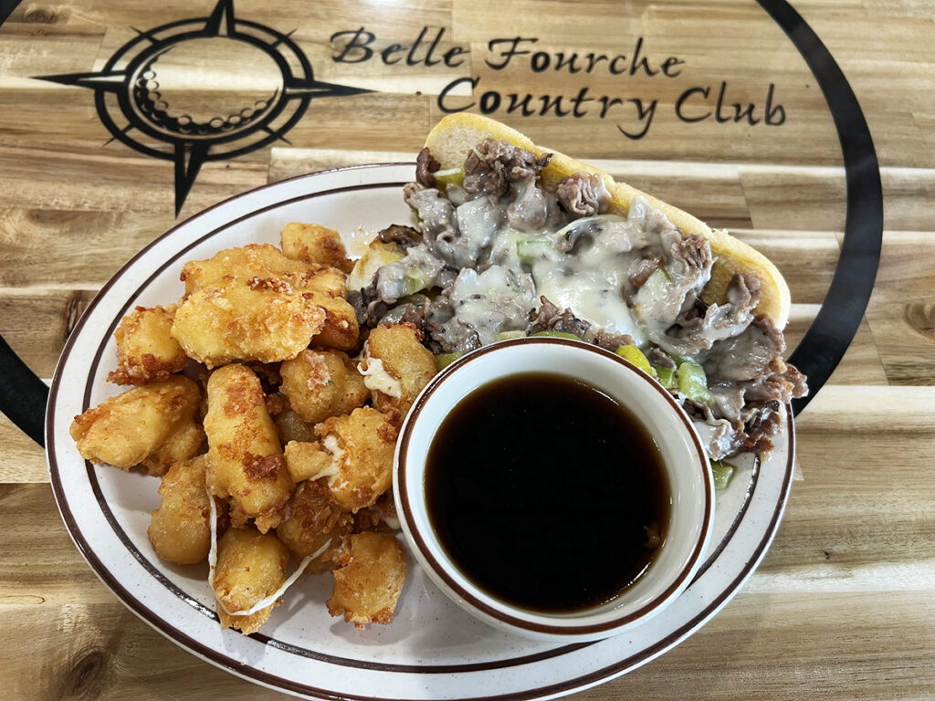 Philly sandwich with cheese curds and au jus at Belle Fourche Country club