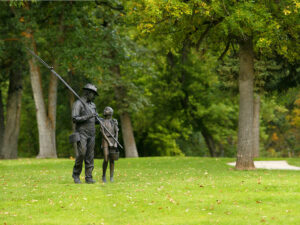 d c booth fish hatchery statues man girl 300x225