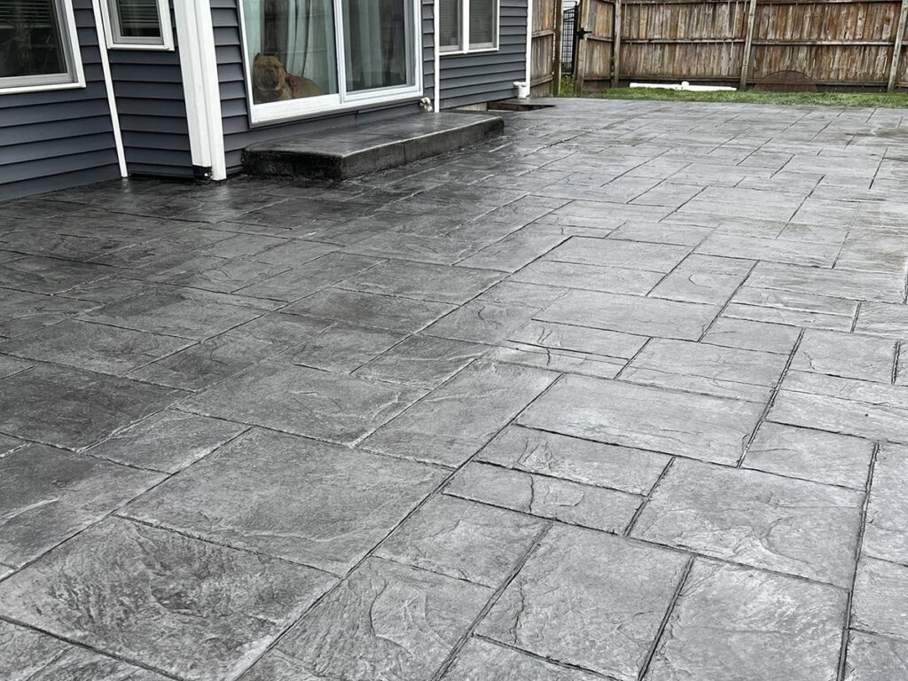 New Era Concrete gray stamped and dyed concrete patio