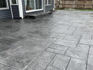 New Era Concrete gray stamped and dyed concrete patio