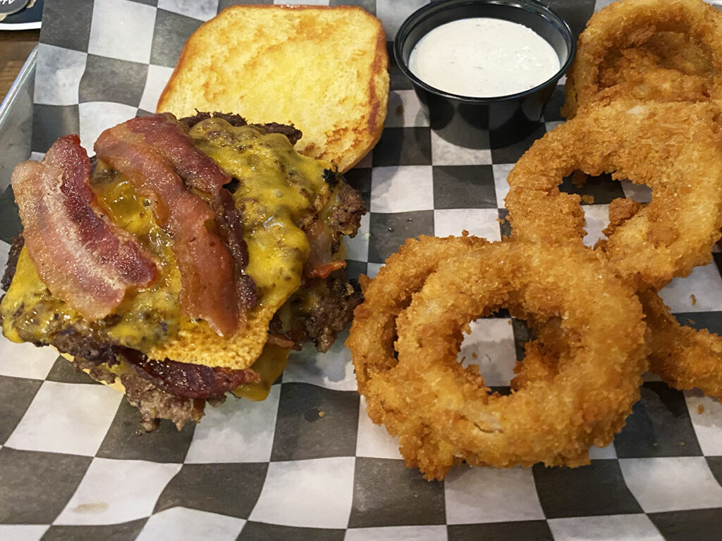 The Social House Rapid City bacon cheeseburger with onion rings