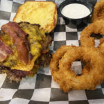 The Social House Rapid City bacon cheeseburger with onion rings